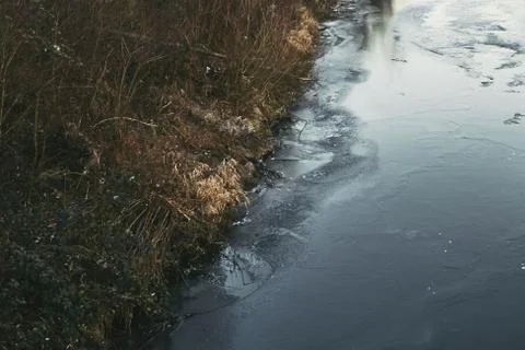 River side on a cold day with reflection Stock Photos