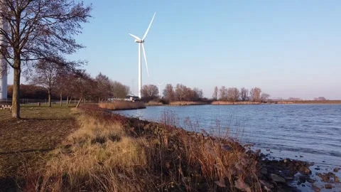 A river side that has a bank made up of boulders. 動画素材 302382203