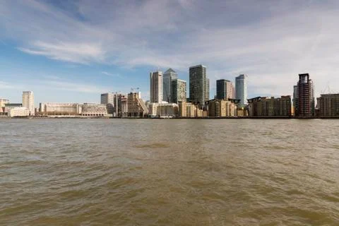 River with skyscrapers in the background Stock Photos
