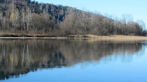 The river with a slow current on the background of the mountains in early spring Stock-Footage 106197210