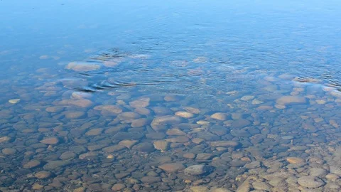 The river with a slow current on the background of the mountains in early spring Stock Footage 106197390