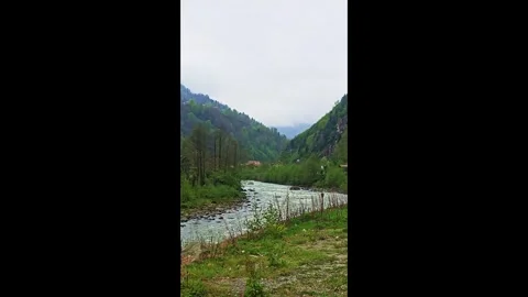 A river with a small house in the middle Stock-Footage 272787046