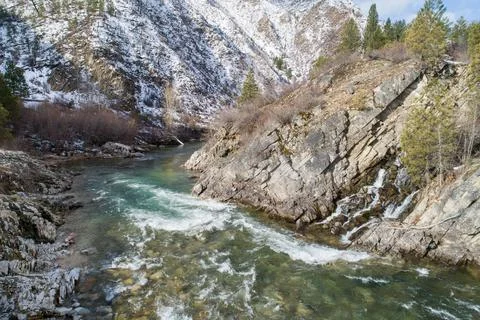 River with snow in the background Stock Photos