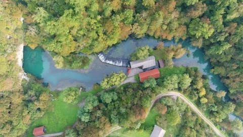 River source and mill buildings aerial view Stock Footage 327071984