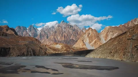 River spill among the desert mountains and clouds in the blue sky Stock Footage 196804791