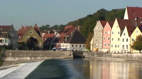 River spillway in front of Old town houses - Bavaria Stock Footage 33476194