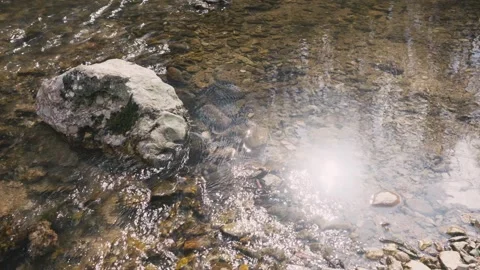 River with stone and reflection of the sun in the water calm water 库存影片 330854296