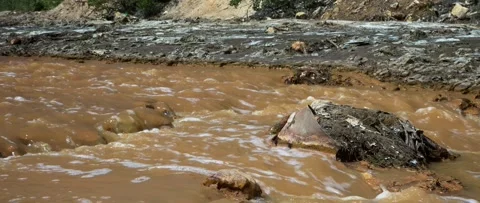 River stream and banks with junk 4K anamorphic video Stock Footage 157739913