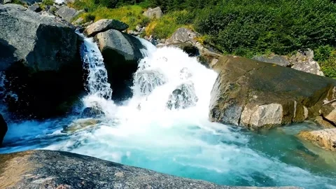 River stream and the waterfall in the mountain forest	 Stock Footage 149321839