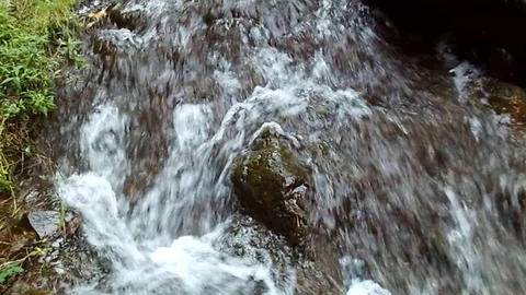 River stream on black stones like small waterfall 스톡 동영상 124947266