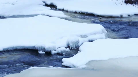 River stream with floating ice in 4K Stock Footage 55450307