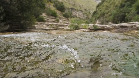 River stream flows in slow motion in Nature Reserve Cavagrande, Sicily Stock Footage 114500794