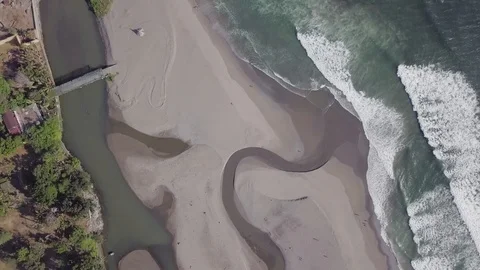 River stream goes in the ocean wave top down view aerial footage Stock Footage 100691932