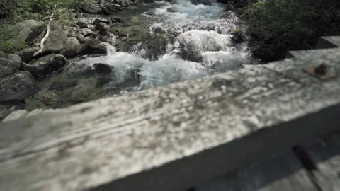River stream looking down and panning up from a bridge Video stock 139205713