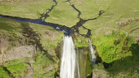 River stream revealing thin waterfall Gljufrabui hidden a small gorge, cliff Stock Footage 138739151