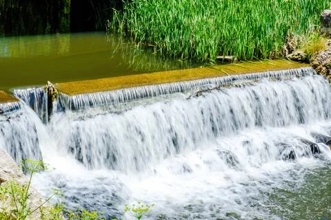 River stream in a small waterfall in mountains Stock Photos