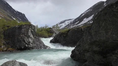 River stream torrent mountains snow 010617 Stock Footage 77245368