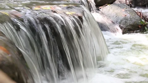 River stream water slowly flow the rocks concept landscape with a waterfall Stock Footage 121086151