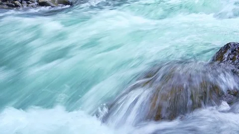 River streaming among smooth boulders. Mountainous watercourse. Sumatra Stock Footage 75006196