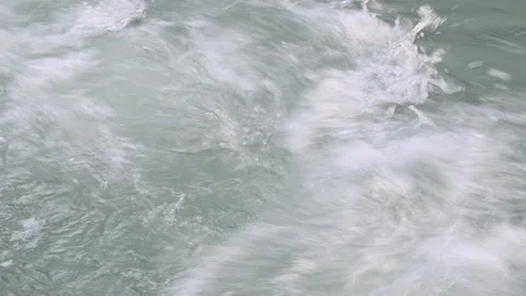 River with strong current after floods makes white foam Stock Footage 137328733