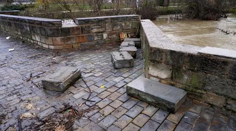 A river with a strong current destroyed the bridge. Stock Photos