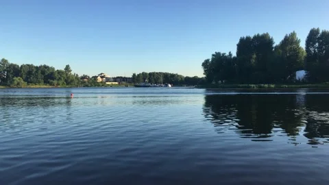 River on a summer evening surrounded by green trees Stock Footage 157097013