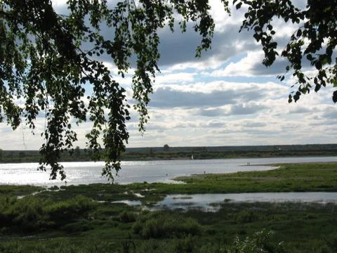 River, summer, forest and cloudy sky Stock Photos