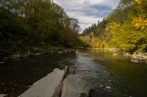 River in the sun and clouds Stock Photos