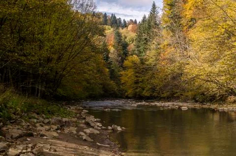 River in the sun and clouds Stock Photos
