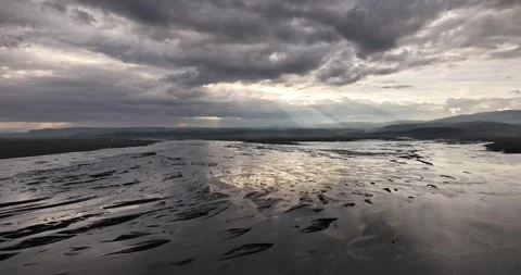 River, sun rays peaking through the clouds, water reflections Stock Footage 296610293