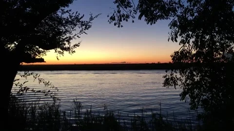 River sunset in Afirca with a boat run form a left side 動画素材 62574533