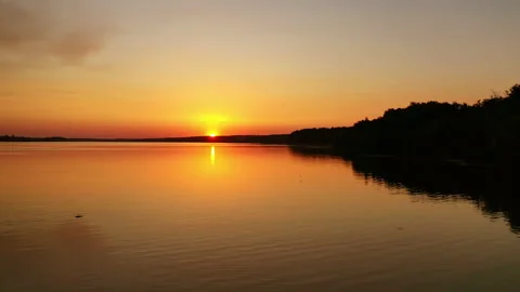 River at sunset. Flight over the evening water. Stock Footage 135895237
