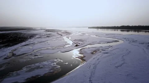 River surface in winter sunset, ice and snow river 動画素材 234302324