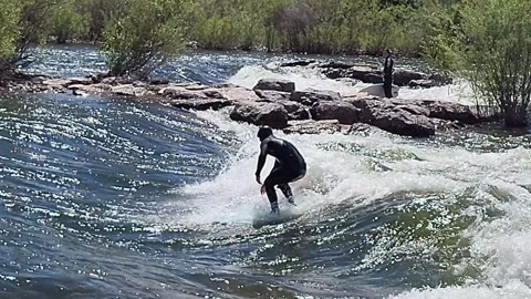 River Surfer riding rapids Brennan's Wave on Clark Fork River Missoula Stock-Footage 338254908