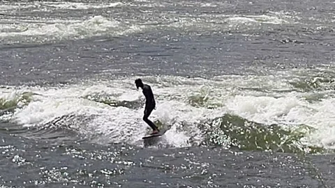 River Surfer riding rapids Brennan's Wave, Clark Fork River Missoula Stock Footage 339974231