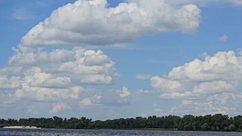 River surrounded by trees. Camping Volumetric clouds. Outdoor recreation. Stock Footage 311048707