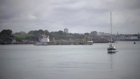 River Tamar Cornwall England. Large coastal ship leaving port. 動画素材 134568528