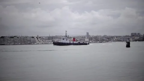River Tamar Devon and Cornwall England. Tugboat heading up river Stock Footage 134568717
