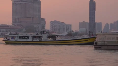 River Taxi Transporting Passengers Along The Chao Phraya River At Sunset Stock Footage 339216617