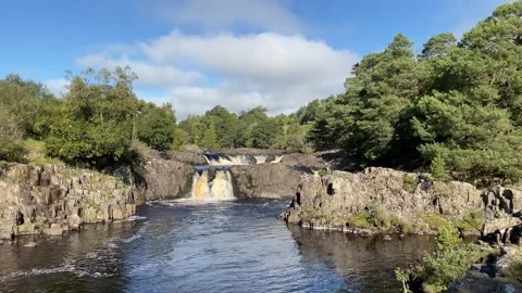 The River Tees at Low Force waterfalls in Autumn, County Durham, England, UK Video stock 285178348