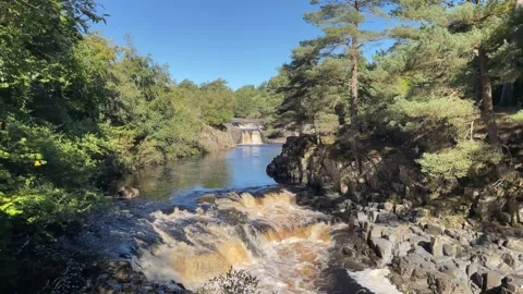 The River Tees at Low Force waterfalls in Autumn, County Durham, England, UK Video stock 285179180