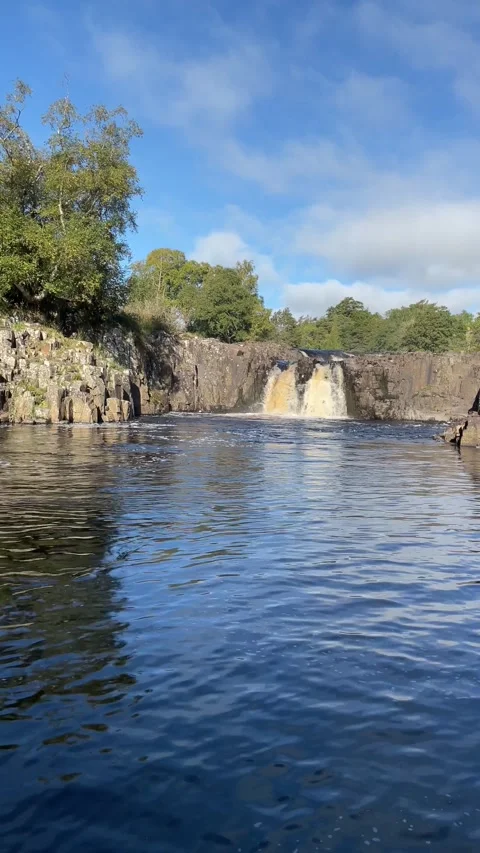 The River Tees at Low Force waterfalls in early Autumn, England, UK Stock Footage 287479018