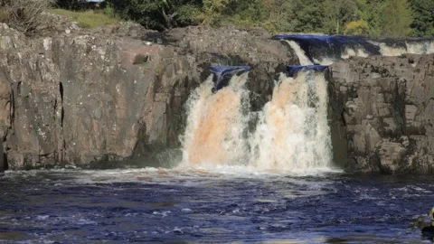 The River Tees at Low Force waterfalls in Autumn, County Durham, England, UK Video stock 313158130