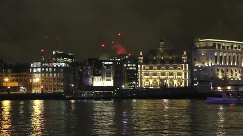 River Thames at night with a river cruise boat sailing past Stock Footage 44872216