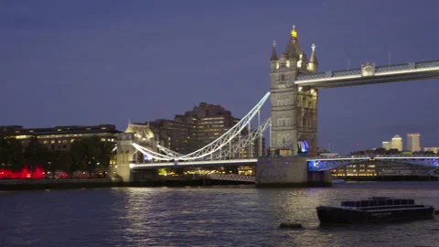 River Thames toward floodlit Tower Bridge Stock Footage 346690458