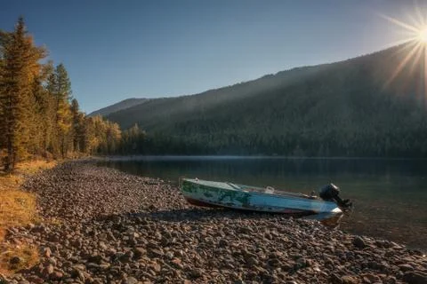 River With Thick Forest And Abandoned Speedboat On The Bank, Altai Mountains Stock Photos