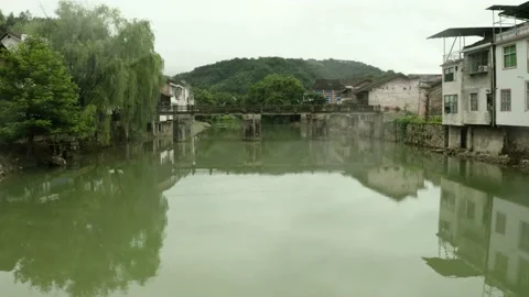 River Through Baisha Ancient Town Stock Footage 171148445
