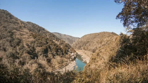 The river through brown valley of mountain in autumn Stock Footage 137379297