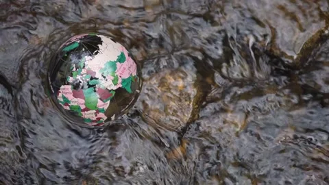 River through a crystal transparent globe ball. glass globe, water is flooding Stock Footage 239062664