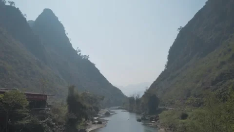 River Through Ha Giang Mountains in Polluted Air Stock Footage 302955142
